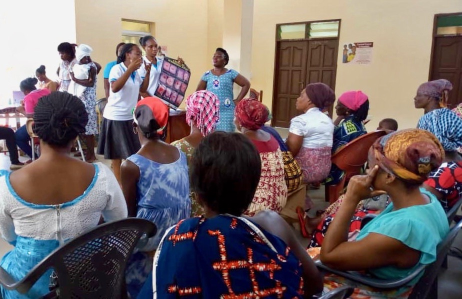 The Cervical Cancer Prevention and Training Centre at Catholic Hospital, Battor, Ghana, trains health care providers to offer cervical cancer services. Here, trainees educate community members in Mafi Dove Health Centre. (Photo courtesy of CCPTC)