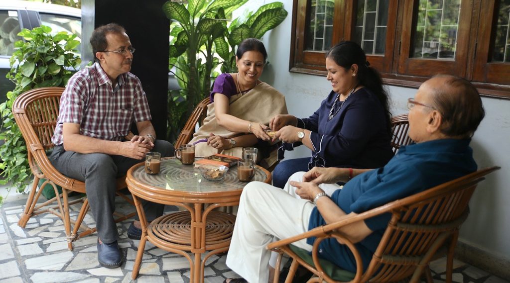 Sangeeta sits with her family, her backbone of support during her cervical cancer diagnosis and treatment