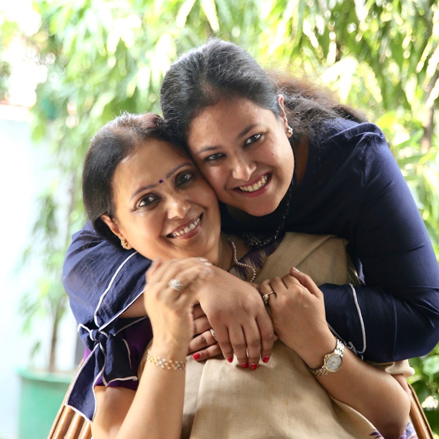 Sangeeta Gupta receives a hug from her daughter