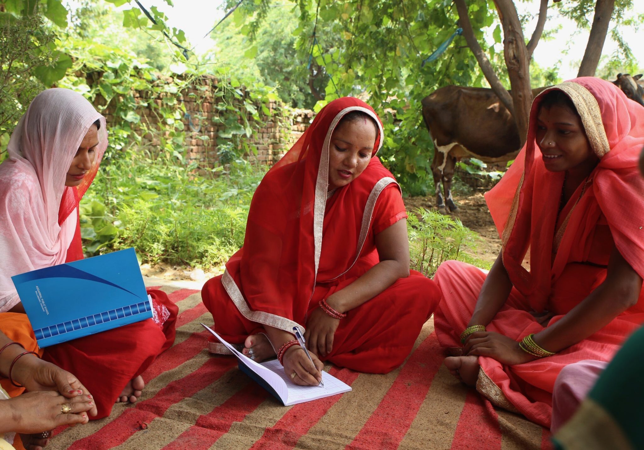 Jagwati, a community health worker, meets with a group of women in her village in India. She finds that women are often embarrassed or fearful to discuss their reproductive health, including issues like cervical cancer.